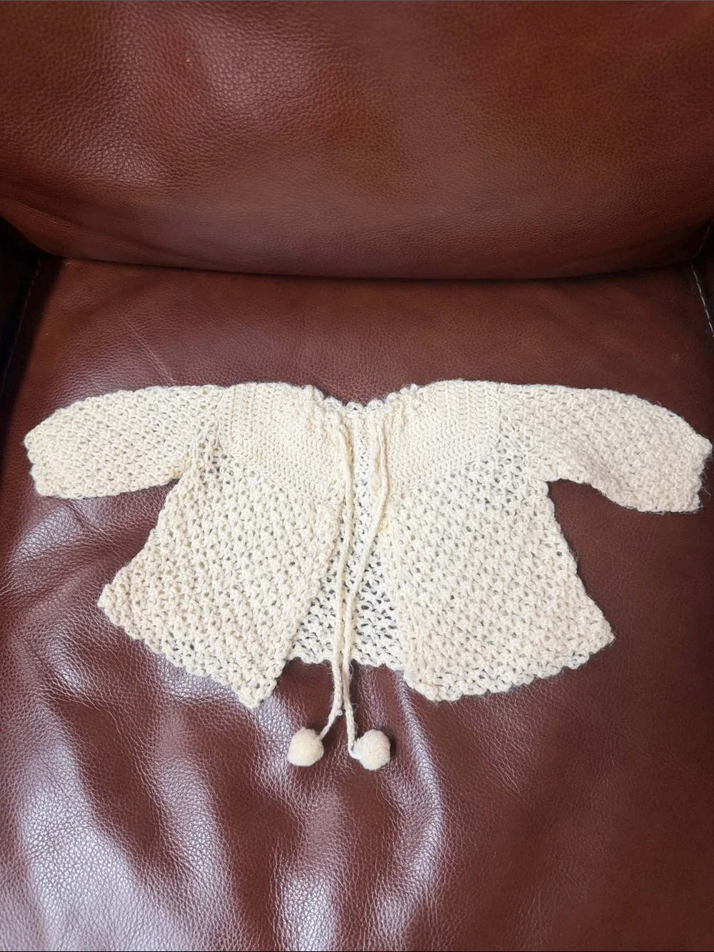 1950’s Cream Knit Open-Front Baby Sweater with Pom Tie